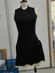 Black sleeveless half high collar mini dress.webp