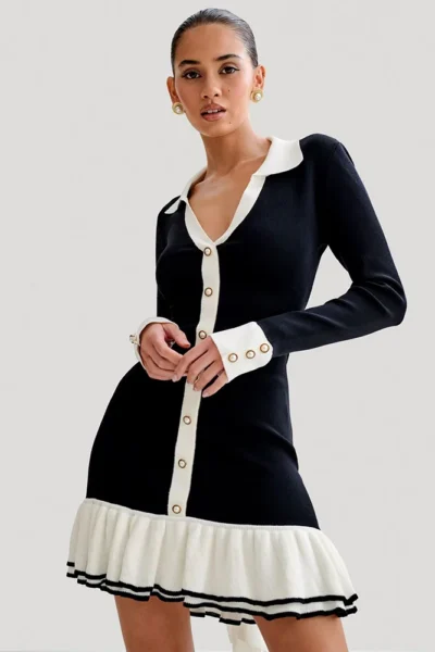 Chic black v-neck knit mini dress with ruffled hem