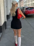 Black sleeveless half high collar mini dress.webp