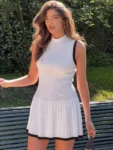 Black sleeveless half high collar mini dress.webp