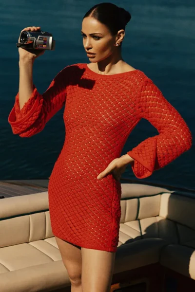 Red knit mini dress with long sleeves on deck