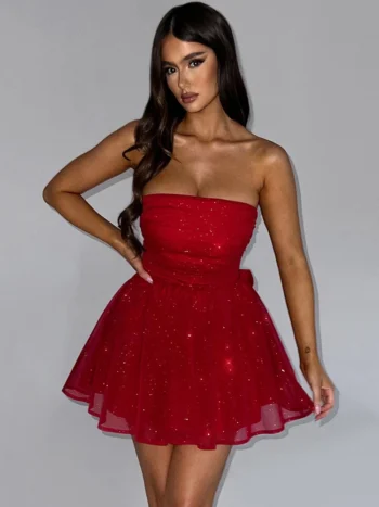 Woman wearing red strapless sparkle mesh mini dress