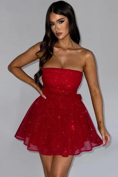 Woman wearing red strapless sparkle mesh mini dress