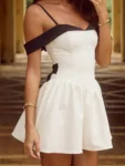 Woman in white and black off-shoulder A-line mini dress