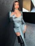 Woman in metallic silver ruched bodycon mini dress front view