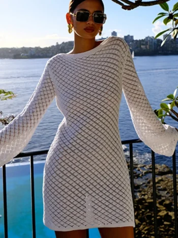White backless knit mini dress with long sleeves on balcony