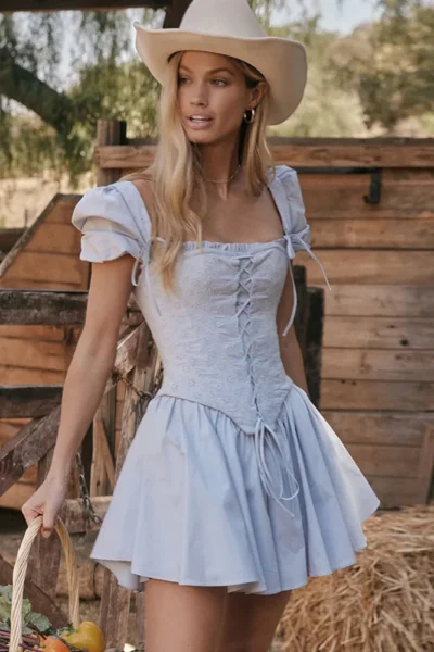 Puff sleeve mini dress side view with A-line pleats