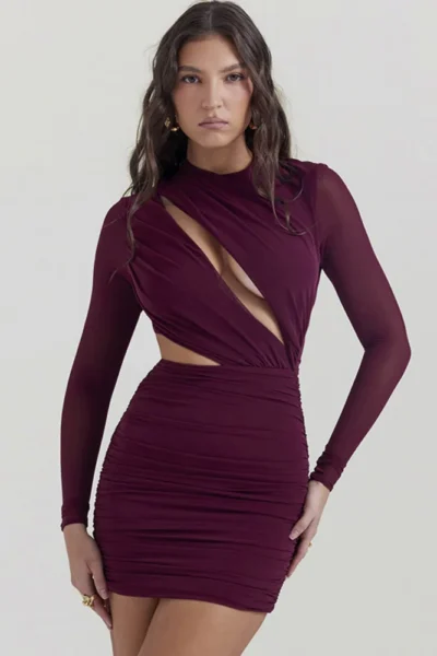 Woman in wine red hollow out sheer mini dress front view