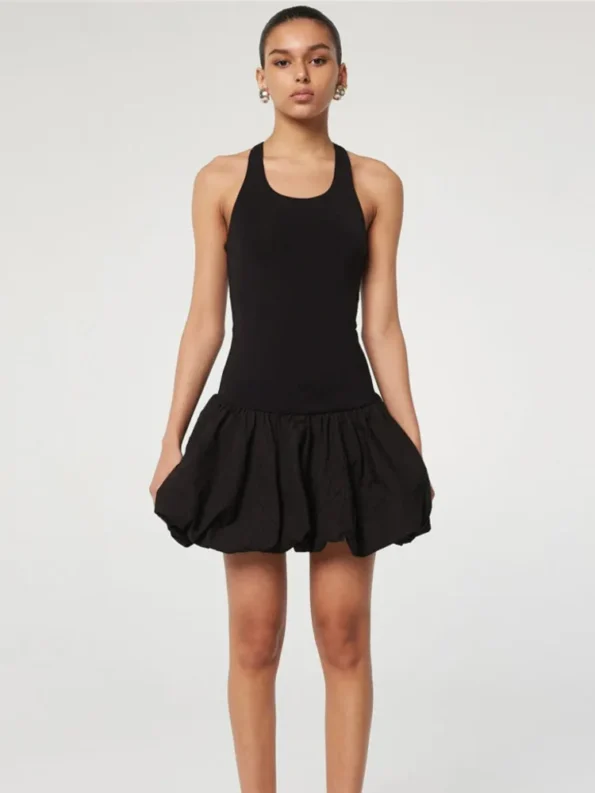 Black sleeveless puffy mini dress on stairs