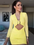 Woman in hollow-out yellow ruched mini dress with deep V neckline