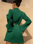 Emerald green pleated mini dress.webp