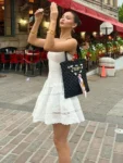 Elegant Off-Shoulder Strapless Mini Dress – White Sitting.webp