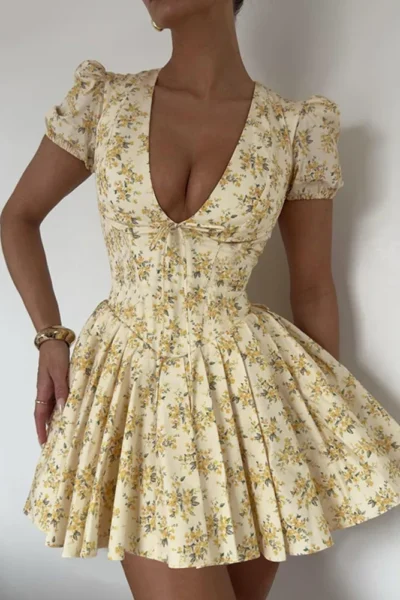 Woman walking in floral pleated A-line mini dress