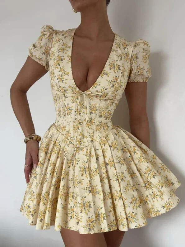 Woman walking in floral pleated A-line mini dress