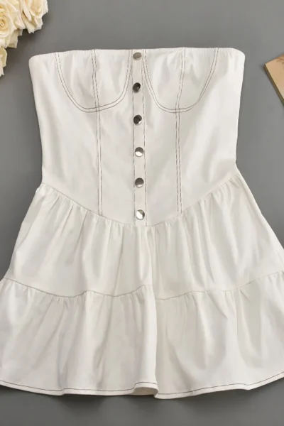 Full view of strapless white mini dress flat lay