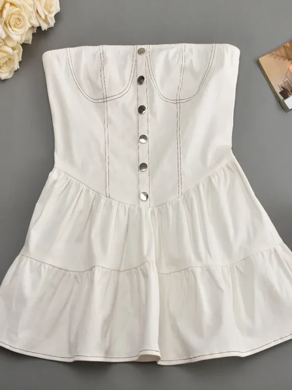 Full view of strapless white mini dress flat lay