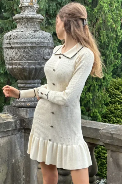 elegant cream knit dress back view with button detail