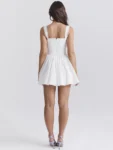 White embroidered mini dress front.webp