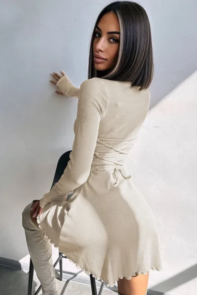 Back view of beige ribbed long sleeve mini dress