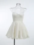 Black spaghetti strap mini dress with tulle skirt.webp