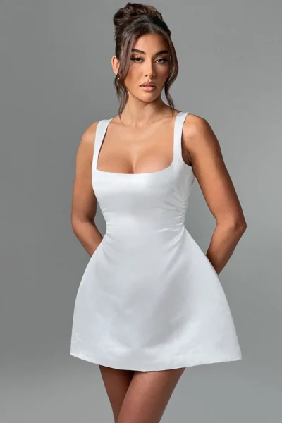 White satin square neck mini dress styled elegantly